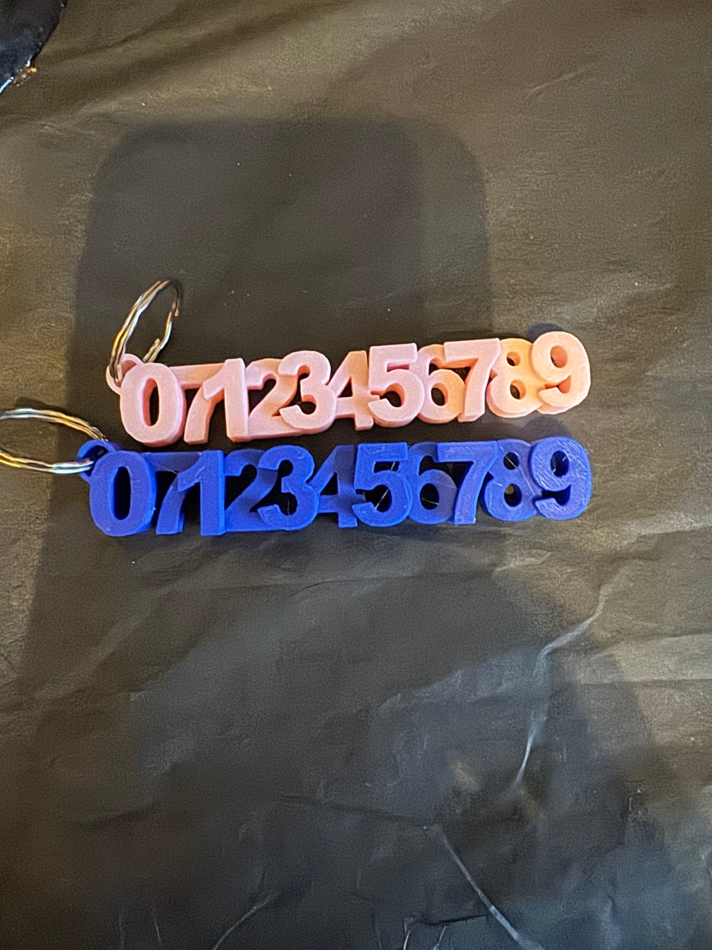 Phone number safety keyrings